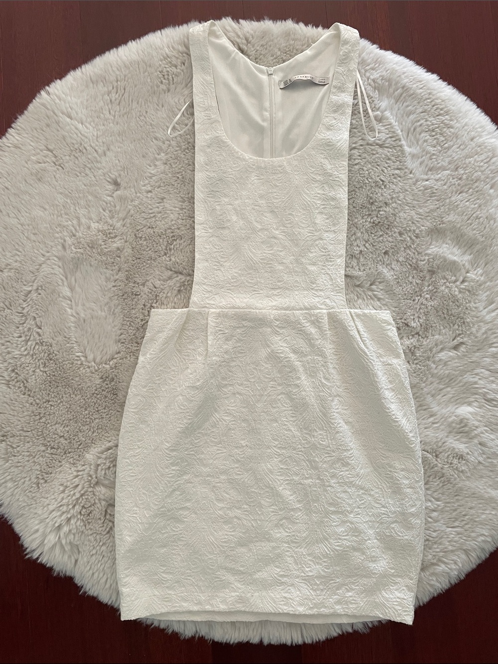 Zara Trafaluc white jacquard mini pinafore dress with a scoop neck.